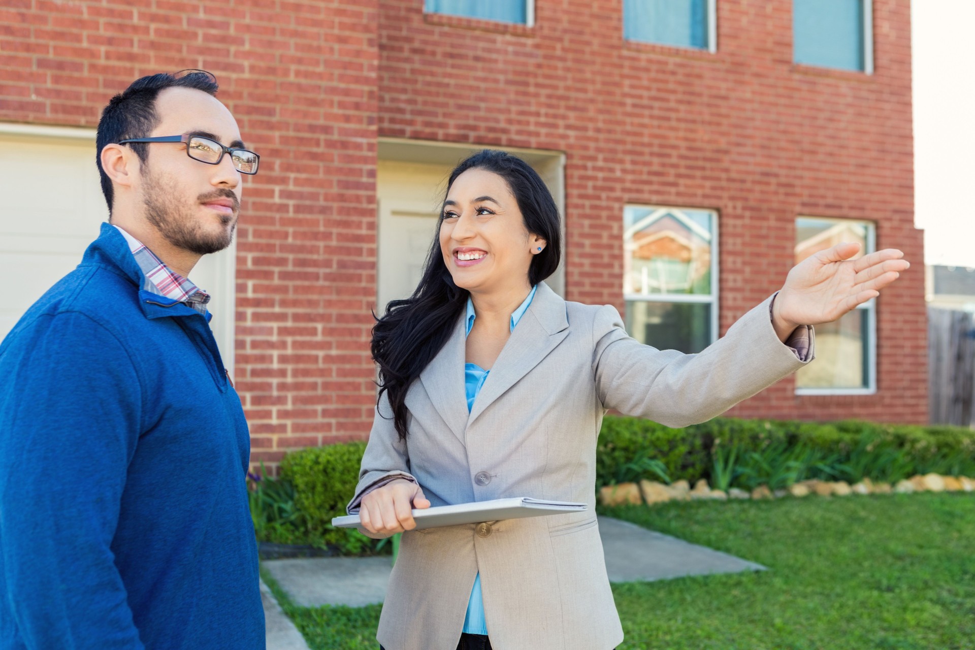 Real Estate Agent discusses home with potential client